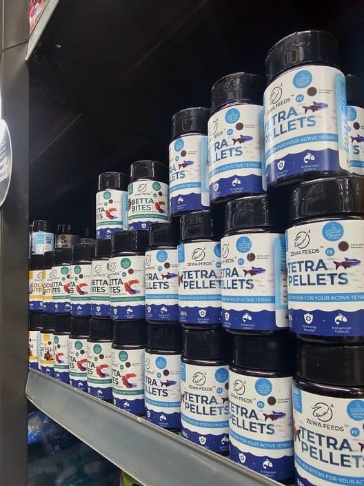 Tetra Pellets bottles stocked on a retail shelf